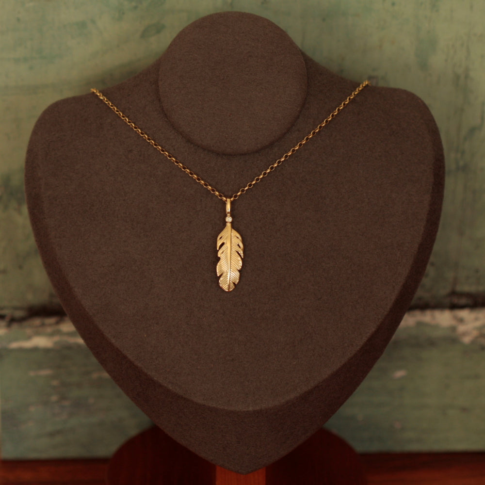 Gold and diamond feather necklace