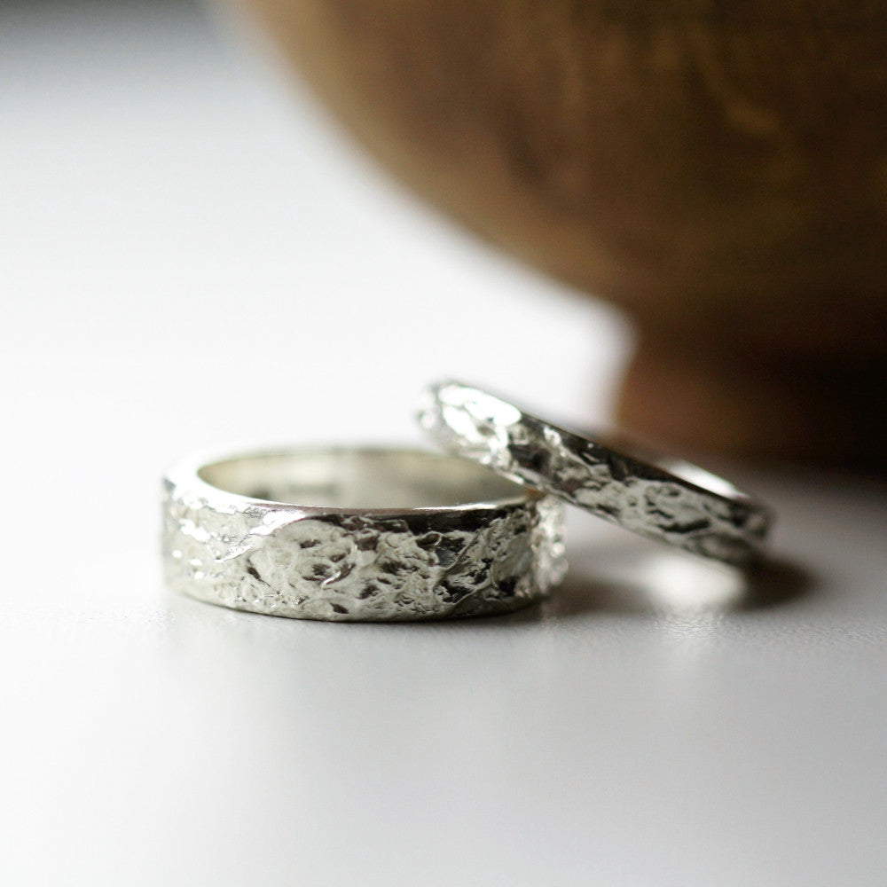 Matching textured sterling silver wide treasure island wedding rings