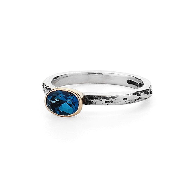 Oval Blue Topaz set in 9ct gold on a Silver Textured Ring Band