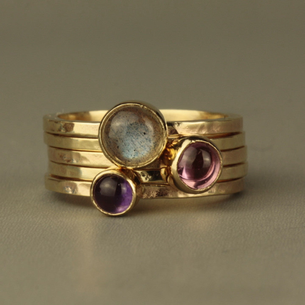 designer solid gold blossom stacking rings featuring Amethyst, Labradorite and Pink Tourmaline cabochon gemstones