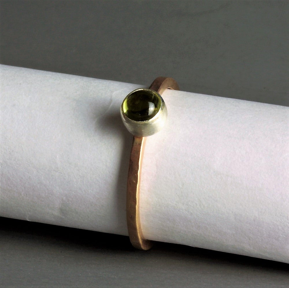 designer silver and gold peridot gemstone ring