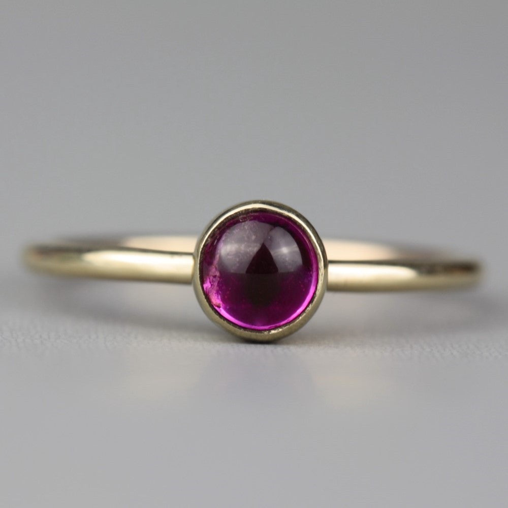 Solid gold stackable ring featuring a stunning pink Tourmaline cabochon gemstone