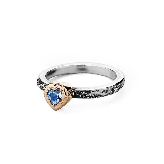 Moonstone heart encased in 9ct gold setting on a textured silver ring