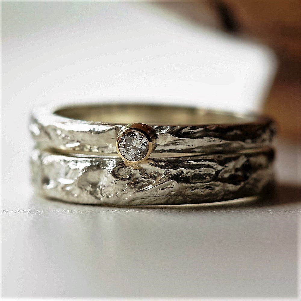 Silver textured treasure ring with a matching diamond treasure ring