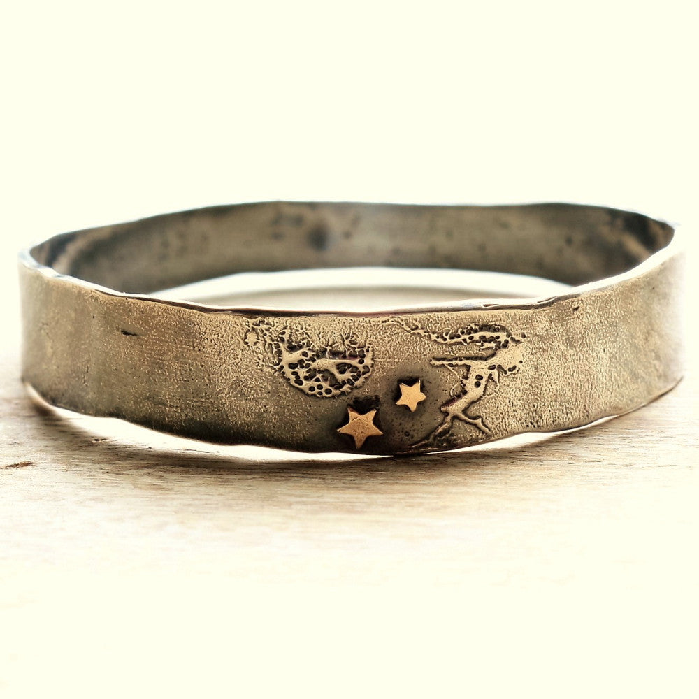 whimsical designer bangle with a fairy design and solid 9ct gold stars