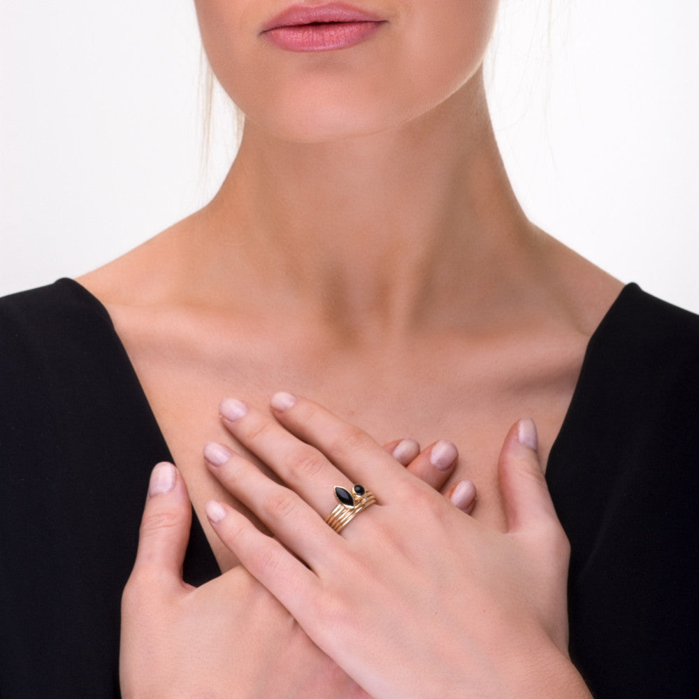 Model wearing marquise black onyx and diamond solid 9ct gold stacking rings