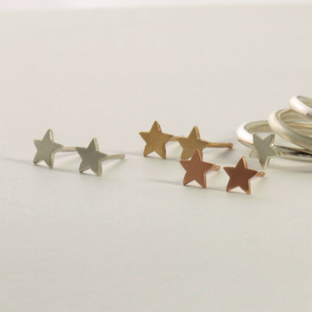 Handmade tiny gold and silver star earrings