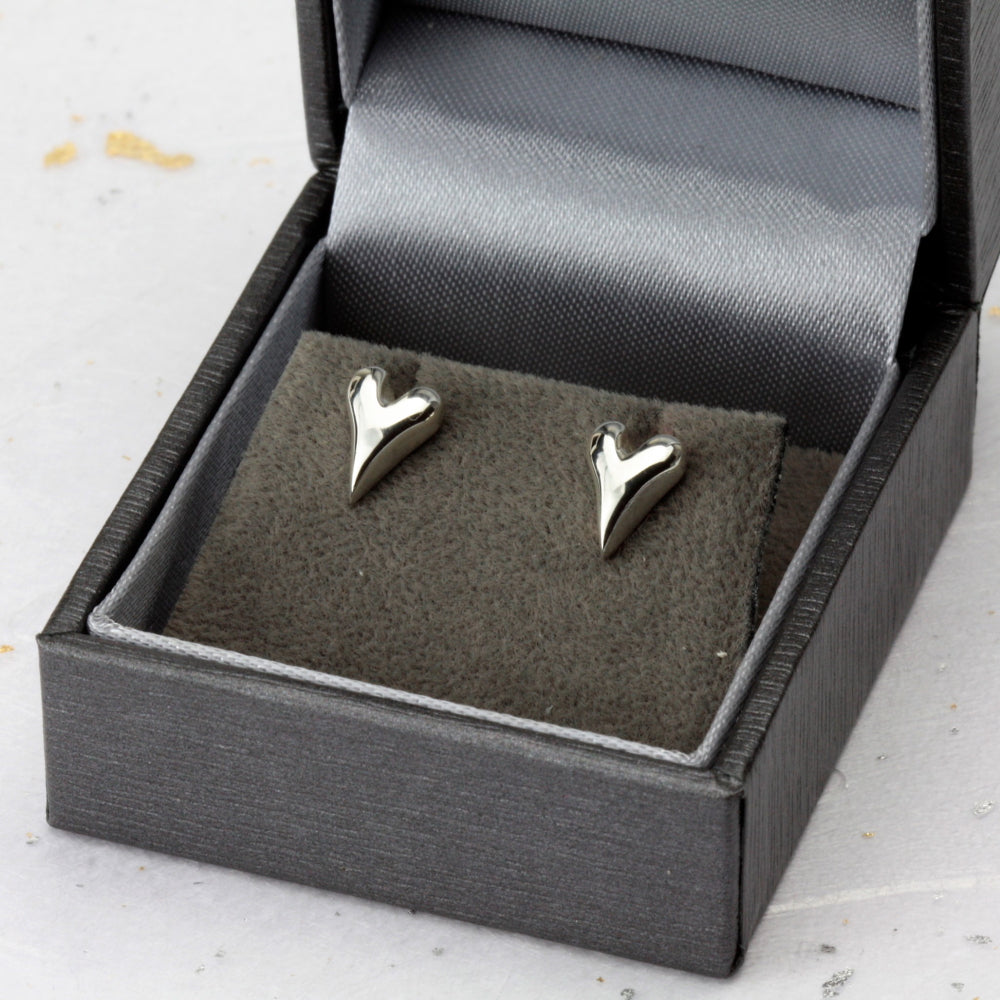 Silver wild at heart earrings shown in our branded packaging