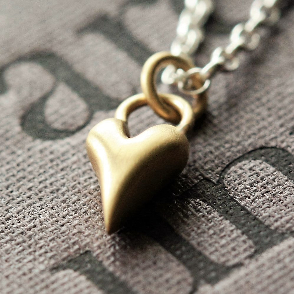 Gold heart pendant and sterling silver chain