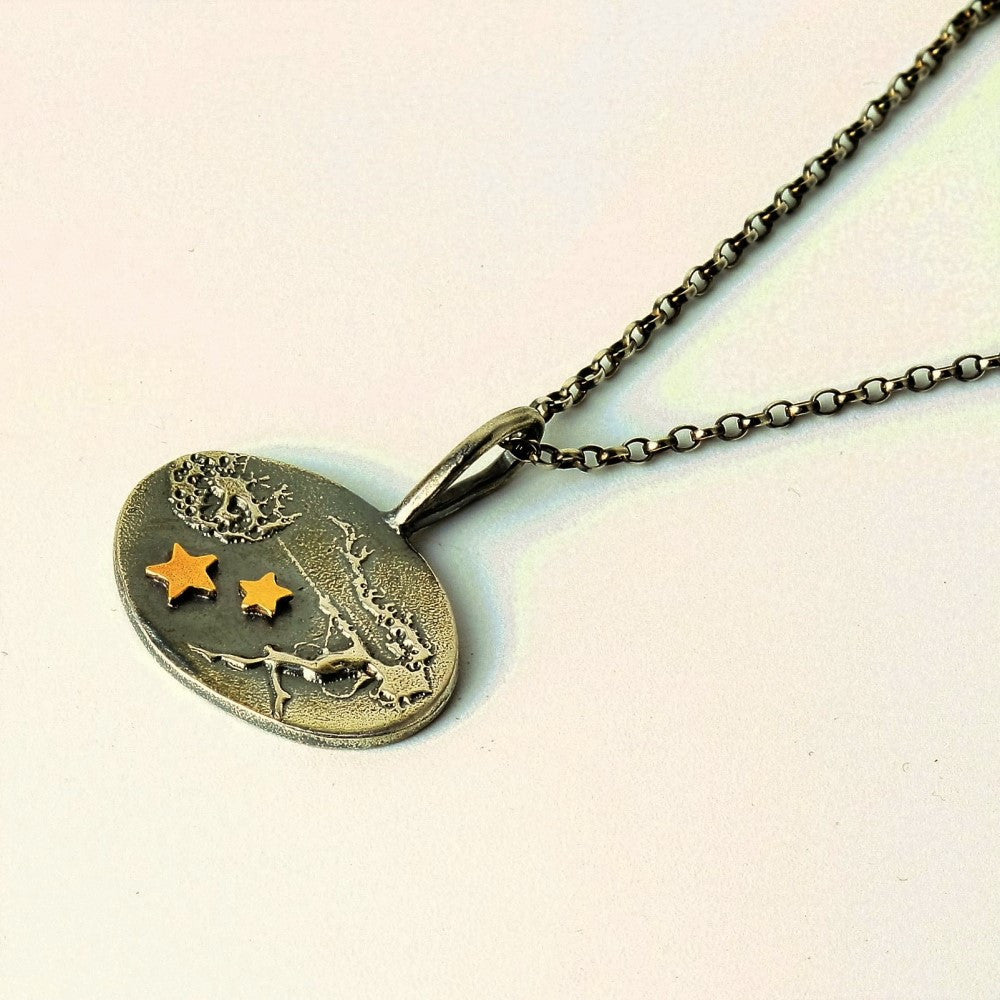Unique fairy necklace holding on to her dandelion with added solid gold stars