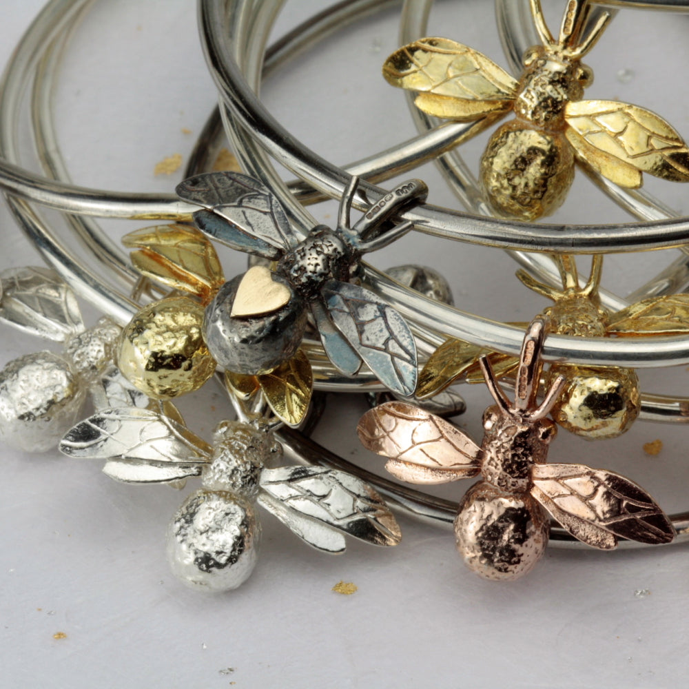 rose, yellow gold, oxidized and silver stacking bee bangles
