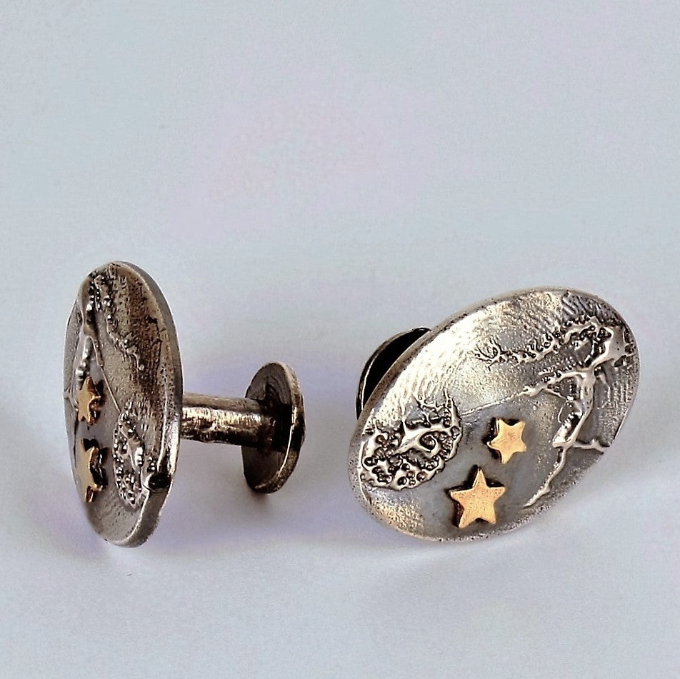 unusual mans fairy cuff links with solid gold stars